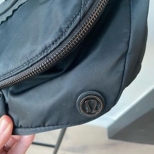 Black Lululemon shoulder or fannypack. Gently used. Lots of pockets.